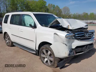 2013 Honda Pilot Touring with VIN 5FNYF3H92DB034731, listed as a IAAI auction lot 42049853 with 127,278 mi miles and . Bid and sale history available at carsss.com. Image 1.
