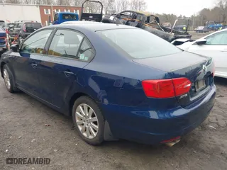 2014 Volkswagen Jetta Sedan S with VIN 3VW1K7AJ2EM421637, listed as a IAAI auction lot 41915643 with 127,258 mi miles. Bid and sale history available at carsss.com. Image 3.