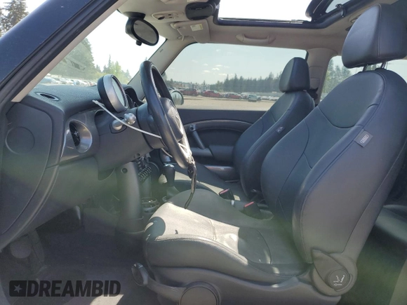 2006 MINI Hardtop with VIN WMWRC33586TJ77908, listed as a Copart auction lot 55095525 with 143,810 mi miles and Salvage title. Bid and sale history available at DreamBid. Image 7.