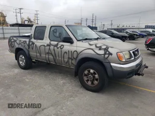 2000 Nissan Frontier XE with VIN 1N6ED27T8YC357939, listed as a Copart auction lot 55727395 with 143,842 mi miles and Salvage title. Bid and sale history available at DreamBid. Image 4.