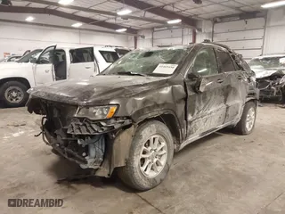 2018 Jeep Grand Cherokee Laredo E with VIN 1C4RJFAG4JC313054, listed as a IAAI auction lot 41469450 with 142,929 mi miles. Bid and sale history available at carsss.com. Image 6.
