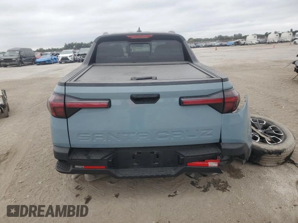 2023 Hyundai Santa Cruz SEL z VIN 5NTJC4AE4PH043025, wystawiony jako Copart lot #41617645 z przebiegiem Nie podano mil oraz Nie do naprawy • Non repairable. Historia ofert i sprzedaży dostępna na DreamBid. Obrazek 6.