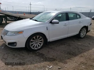 2012 Lincoln MKS EcoBoost with VIN 1LNHL9FT0CG806797, listed as a Copart auction lot 73246194 with 184,950 mi miles and Salvage title. Bid and sale history available at DreamBid. Image 1.