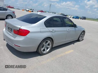 2013 BMW 3 Series 328i with VIN WBA3C1G5XDNR45054, listed as a IAAI auction lot 42504007 with 152,705 mi miles and . Bid and sale history available at DreamBid. Image 4.
