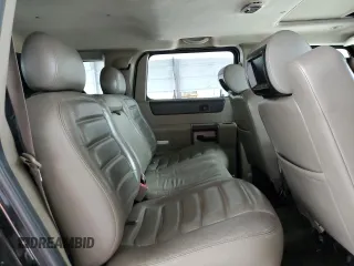 2003 Hummer H2 with VIN 5GRGN23U33H118459, listed as a Copart auction lot 77765694 with 157,390 mi miles and Salvage Title. Bid and sale history available at carsss.com. Image 11.