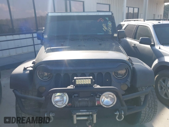 2011 Jeep Wrangler Rubicon with VIN 1J4BA6D10BL628180, listed as a IAAI auction lot 41711065 with 155,940 mi miles and . Bid and sale history available at carsss.com. Image 12.