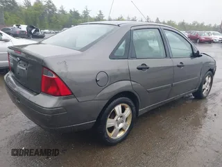 2007 Ford Focus S z VIN 1FAFP34N77W336075, wystawiony jako IAAI lot #42325783 z przebiegiem 153 194 mil mil oraz . Historia ofert i sprzedaży dostępna na DreamBid. Obrazek 4.