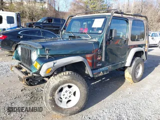 2000 Jeep Wrangler Sahara with VIN 1J4FA59S0YP724521, listed as a IAAI auction lot 41574689 with 167,584 mi miles. Bid and sale history available at carsss.com. Image 2.