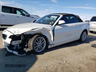 2015 BMW 2 Series 228i xDrive with VIN WBA1K7C57FV235082, listed as a Copart auction lot 87412554 with 75,061 mi miles and Salvage Title. Bid and sale history available at DreamBid. Image 1.