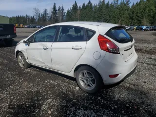 2018 Ford Fiesta SE with VIN 3FADP4EJ1JM128130, listed as a Copart auction lot 50574285 with 141,002 mi miles and Salvage Title. Bid and sale history available at DreamBid. Image 2.
