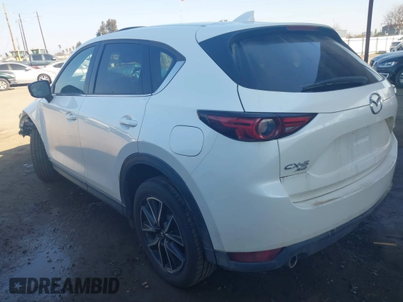2017 Mazda CX-5 Grand Touring with VIN JM3KFBDL6H0164993, listed as a IAAI auction lot 41450556 with 97,733 mi miles. Bid and sale history available at carsss.com. Image 3.