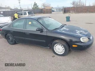 1997 Mercury Sable GS with VIN 1MELM50U5VA656308, listed as a IAAI auction lot 41882560 with 91,017 mi miles. Bid and sale history available at carsss.com. Image 1.