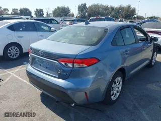 2024 Toyota Corolla Hybrid LE with VIN JTDBCMFE5RJ030239, listed as a IAAI auction lot 40489207 with 5,295 mi miles. Bid and sale history available at carsss.com. Image 4.