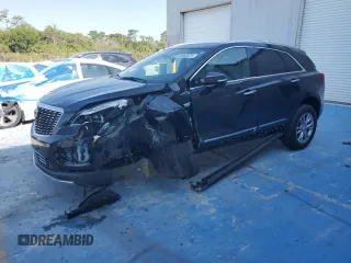 2022 Cadillac XT5 FWD Premium Luxury z VIN 1GYKNCRS7NZ104983, wystawiony jako Copart lot #54960675 z przebiegiem 52 645 mil mil oraz Nie do naprawy • Non repairable. Historia ofert i sprzedaży dostępna na DreamBid. Obrazek 1.