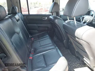 2011 Honda Pilot Touring with VIN 5FNYF4H94BB035415, listed as a IAAI auction lot 42126738 with 239,273 mi miles. Bid and sale history available at carsss.com. Image 8.