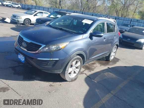 2012 Kia Sportage LX with VIN KNDPBCA28C7273676, listed as a IAAI auction lot 42034764 with 121,527 mi miles and . Bid and sale history available at DreamBid. Image 2.