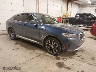 2023 BMW X4 xDrive30i with VIN 5UX33DT01P9R31277, listed as a IAAI auction lot 41618617 with 23,952 mi miles. Bid and sale history available at carsss.com. Image 1.
