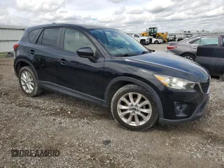 2014 Mazda CX-5 Grand Touring with VIN JM3KE4DY3E0304908, listed as a Copart auction lot 53873655 with 144,382 mi miles and Salvage Title. Bid and sale history available at DreamBid. Image 4.