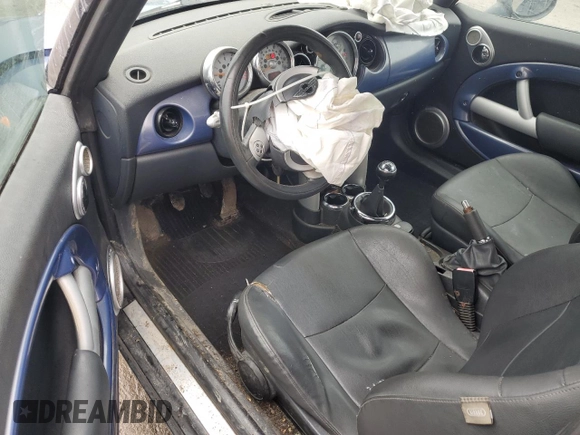 2005 MINI Convertible z VIN WMWRF33435TF60350, wystawiony jako Copart lot #50545005 z przebiegiem 91 078 mil mil oraz Szkoda całkowita • Salvage title. Historia ofert i sprzedaży dostępna na DreamBid. Obrazek 8.