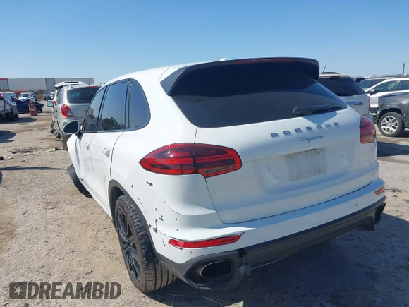 2016 Porsche Cayenne with VIN WP1AA2A29GLA04374, listed as a IAAI auction lot 41988374 with 144,716 mi miles. Bid and sale history available at carsss.com. Image 3.