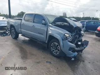 2020 Toyota Tacoma SR5 with VIN 3TMDZ5BN3LM080702, listed as a IAAI auction lot 42463811 with 70,185 mi miles and . Bid and sale history available at DreamBid. Image 1.
