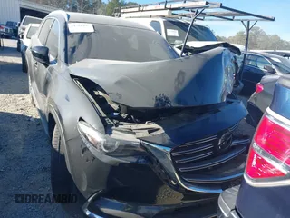 2020 Mazda CX-9 Grand Touring with VIN JM3TCADY8L0405173, listed as a IAAI auction lot 41701533 with 58,119 mi miles and . Bid and sale history available at DreamBid. Image 12.