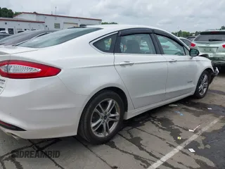 2016 Ford Fusion Titanium Hybrid with VIN 3FA6P0RU3GR190355, listed as a IAAI auction lot 42384309 with 157,172 mi miles and . Bid and sale history available at DreamBid. Image 13.