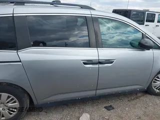 2016 Honda Odyssey LX with VIN 5FNRL5H23GB028338, listed as a IAAI auction lot 41980064 with 186,403 mi miles and . Bid and sale history available at DreamBid. Image 13.