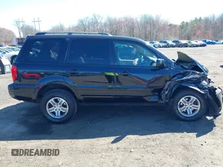 2005 Honda Pilot EX-L with VIN 5FNYF18555B043104, listed as a IAAI auction lot 41888235 with 127,781 mi miles. Bid and sale history available at carsss.com. Image 13.