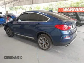 2015 BMW X4 xDrive28i with VIN 5UXXW3C51F0M87268, listed as a IAAI auction lot 42366363 with 143,285 mi miles and . Bid and sale history available at DreamBid. Image 3.