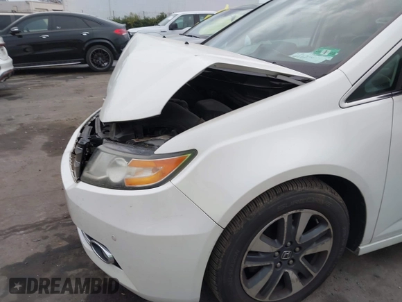 2014 Honda Odyssey Touring with VIN 5FNRL5H94EB001479, listed as a IAAI auction lot 41123678 with 147,269 mi miles and . Bid and sale history available at carsss.com. Image 18.