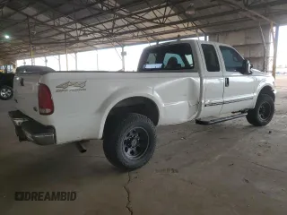 2000 Ford Super Duty F-250 XL with VIN 1FTNX21S9YED03242, listed as a Copart auction lot 74542704 with 218,739 mi miles and Salvage Title. Bid and sale history available at carsss.com. Image 3.