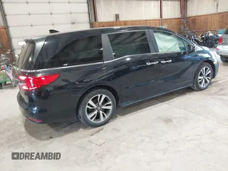 2021 Honda Odyssey Touring z VIN 5FNRL6H83MB028264, wystawiony jako IAAI lot #42206204 z przebiegiem 45 332 mil mil oraz . Historia ofert i sprzedaży dostępna na DreamBid. Obrazek 4.