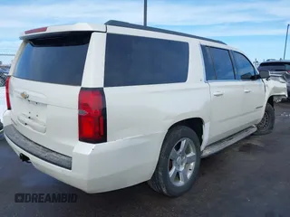 2015 Chevrolet Suburban LT with VIN 1GNSKJKC0FR309866, listed as a IAAI auction lot 41743848 with 220,778 mi miles and . Bid and sale history available at DreamBid. Image 4.