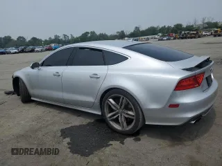 2015 Audi RS 7 с VIN WAUW2CFC5FN013049, выставлен на аукционе Copart как лот 57957093 с пробегом 95 826 миль миль и . История ставок и продаж доступна на DreamBid. Изображение 2.