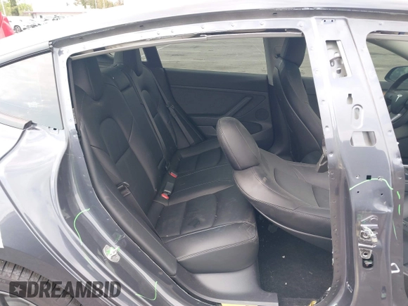 2023 Tesla Model 3 with VIN 5YJ3E1EA4PF410060, listed as a IAAI auction lot 42067624 with 59,934 mi miles and . Bid and sale history available at DreamBid. Image 8.