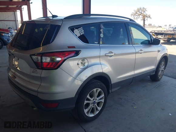 2018 Ford Escape SE with VIN 1FMCU0G90JUC63679, listed as a IAAI auction lot 41658115 with 154,106 mi miles. Bid and sale history available at carsss.com. Image 4.