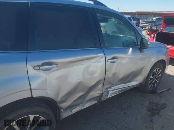 2017 Subaru Forester Touring with VIN JF2SJGTC9HH409665, listed as a IAAI auction lot 41749546 with 118,635 mi miles. Bid and sale history available at carsss.com. Image 6.