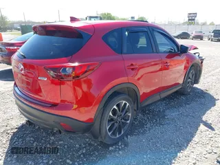 2016 Mazda CX-5 Grand Touring with VIN JM3KE2DYXG0652017, listed as a IAAI auction lot 42041158 with 95,946 mi miles and . Bid and sale history available at DreamBid. Image 4.