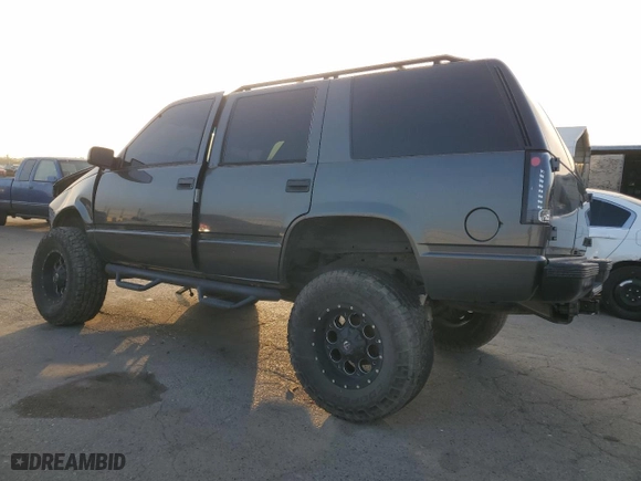 1999 Chevrolet Tahoe with VIN 1GNEC13R0XJ495650, listed as a Copart auction lot 85348144 with 0 mi miles and Salvage Title. Bid and sale history available at carsss.com. Image 2.