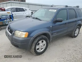 2001 Ford Escape XLT with VIN 1FMYU03131KF10968, listed as a Copart auction lot 67849474 with 197,328 mi miles and Salvage Title. Bid and sale history available at carsss.com. Image 1.