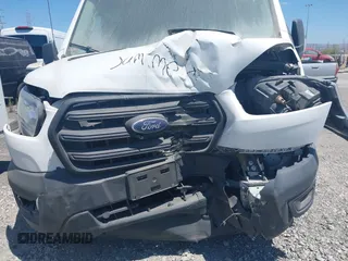 2020 Ford Transit Cargo z VIN 1FTBR1X84LKB78275, wystawiony jako IAAI lot #41825509 z przebiegiem 78 826 mil mil oraz . Historia ofert i sprzedaży dostępna na DreamBid. Obrazek 6.