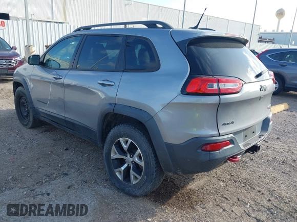 2015 Jeep Cherokee Trailhawk with VIN 1C4PJMBS3FW662307, listed as a IAAI auction lot 41778932 with 64,569 mi miles. Bid and sale history available at carsss.com. Image 3.