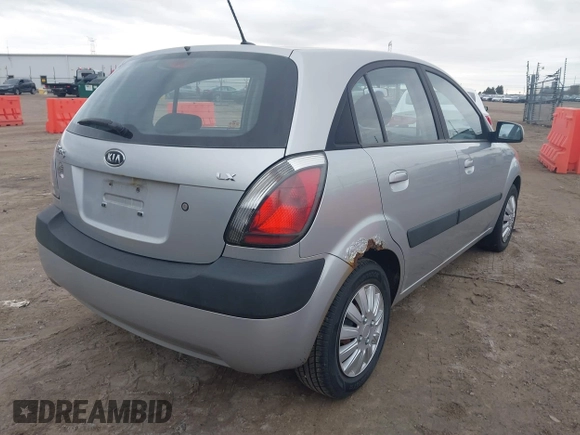2009 Kia Rio LX with VIN KNADE243596544181, listed as a IAAI auction lot 41876733 with 200,216 mi miles. Bid and sale history available at carsss.com. Image 4.