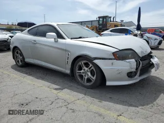 2006 Hyundai Tiburon GT z VIN KMHHN65F06U203701, wystawiony jako Copart lot #52374135 z przebiegiem 90 796 mil mil oraz Szkody całkowita. Historia ofert i sprzedaży dostępna na DreamBid. Obrazek 4.