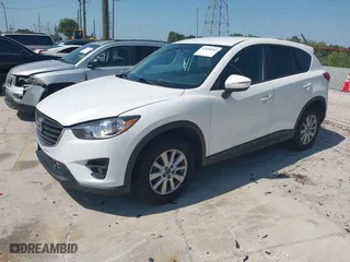 2016 Mazda CX-5 Touring with VIN JM3KE4CY1G0914990, listed as a IAAI auction lot 42030264 with 147,578 mi miles. Bid and sale history available at carsss.com. Image 17.