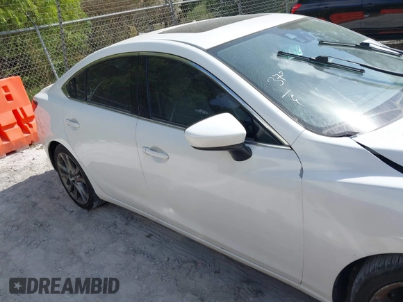 2015 Mazda 6 i Grand Touring with VIN JM1GJ1W50F1204322, listed as a IAAI auction lot 40694216 with 141,357 mi miles. Bid and sale history available at carsss.com. Image 13.
