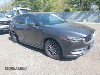 2020 Mazda CX-5 Touring z VIN JM3KFBCM1L1867480, wystawiony jako IAAI lot #42161417 z przebiegiem 39 369 mil mil oraz . Historia ofert i sprzedaży dostępna na DreamBid. Obrazek 1.
