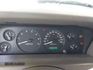 1999 Jeep Grand Cherokee Limited z VIN 1J4GW68N0XC512229, wystawiony jako IAAI lot #42189815 z przebiegiem 230 028 mil mil oraz . Historia ofert i sprzedaży dostępna na DreamBid. Obrazek 7.