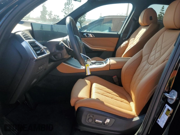 2025 BMW X5 sDrive40i with VIN 5UX13EU05S9W82678, listed as a Copart auction lot 49857255 with 9,901 mi miles and Salvage Title. Bid and sale history available at carsss.com. Image 7.